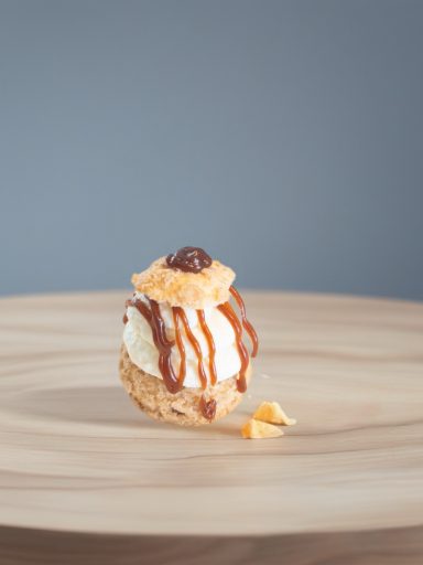Caramel Cream Puff A cream puff treat drizzeled with caramel